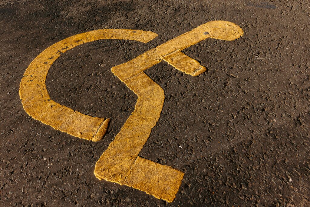 Wheelchair parking logo on pavement